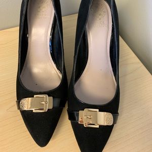 Vince Camuto black pumps with a gold buckle